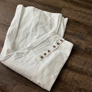 White pants with side buttons